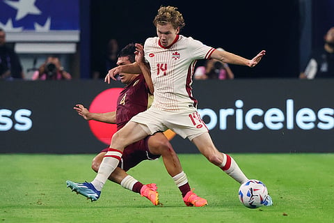 Jacob Shaffelburg and Jon Mikel Aramburu balltle for the ball